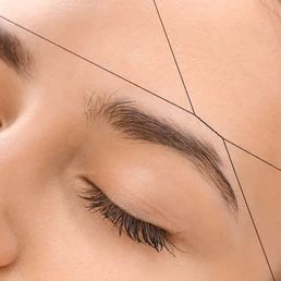 Precision Eyebrow Threading Services Close-up of eyebrow threading being performed at Divine Lotus beauty salon in Wolverhampton.